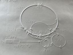 　大型加速器を説明する触図（高エネルギー加速器研究機構提供）